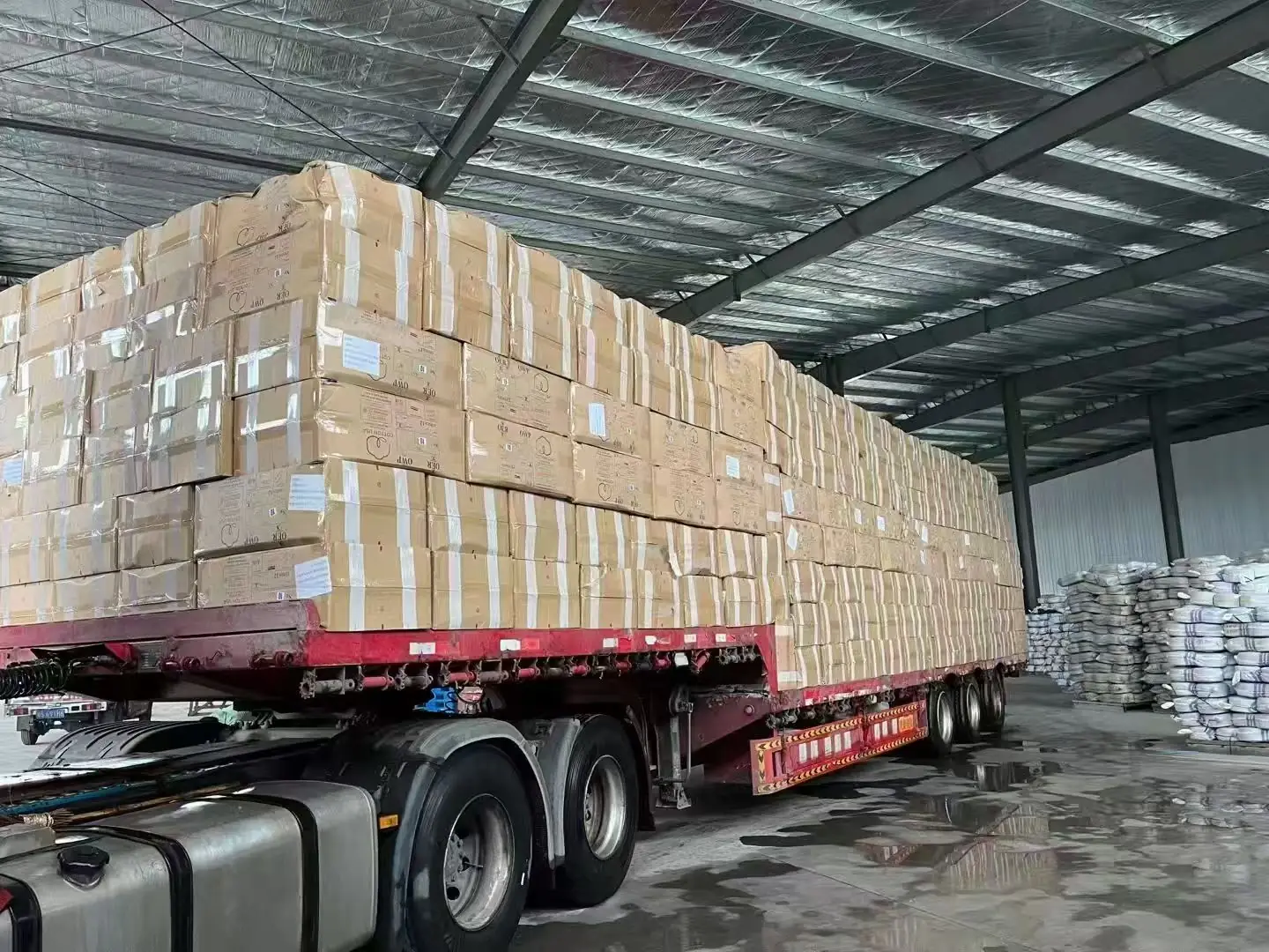 Flatbed trailer loaded with cartons